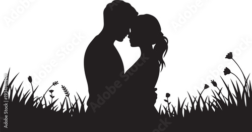 Black silhouette of couple kissing in grass with flowers