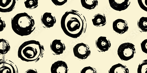 Abstract background with swirling black brushstrokes on a beige canvas