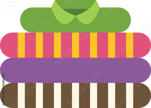 Stacked, folded clothes with a green shirt on top, representing organization and laundry