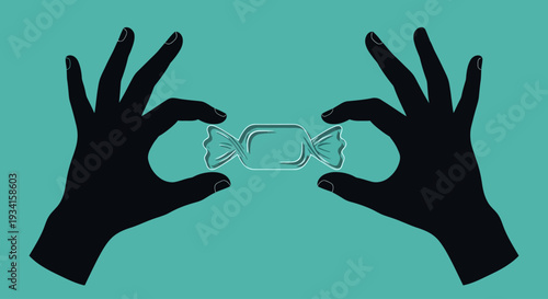 A pair of hands holding a piece of candy in a playful gesture