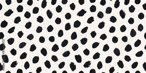 Abstract black brushstrokes create a seamless organic spotted pattern
