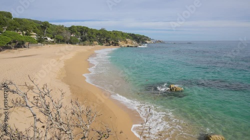 Beautiful empty sandy beach with turquoise sea water