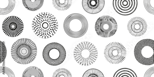 Abstract arrangement of concentric circles and radial patterns in black and white