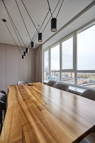 Modern dining room with pendant lights and city view