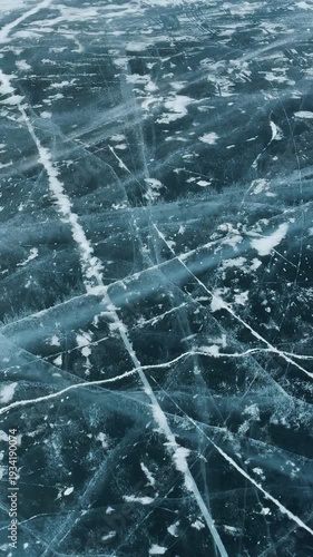 Crystal clear lake ice at Lake Baikal shows stunning patterns and colors in winter
