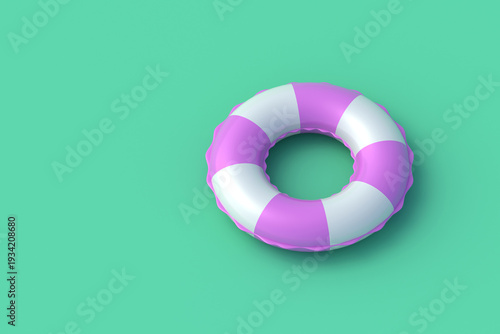 Inflatable ring for swim on green background. Beach accessory. Pool toy. Copy space. 3d render