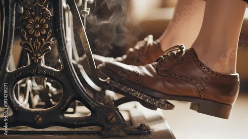 Closeup of a persons feet wearing brown leather shoes operating the foot pedal of an antique sewing machine creating a vintage crafting atmosphere.