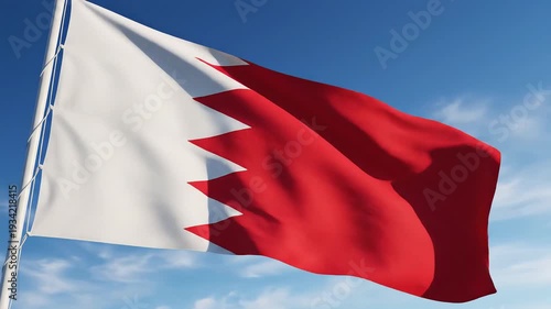 Bahrain flag waving in the wind against a clear blue sky symbolizing national pride and patriotism perfect for travel and cultural content.
