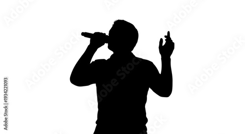 Silhouette of a man singing into a microphone