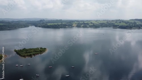 Dramatic Cloud Reflections in Carsington Water with Islands and Sailing Boats Aerial View Derbyshire