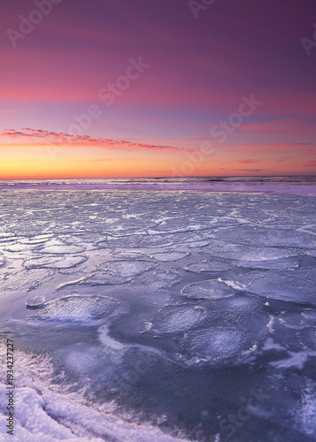 romantic sunset over the frozen Baltic Sea 