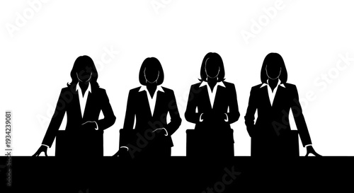 Silhouettes of Four Business Women Standing.