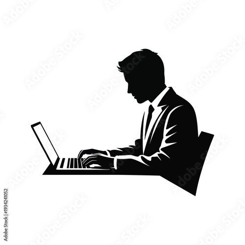 Businessman working on laptop computer in office setting