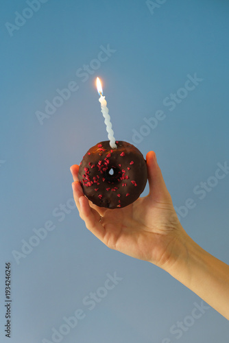 hand holding a candle