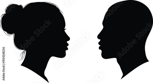 Male and female face profile silhouettes facing each other, black and white human head illustration for communication and relationship concepts