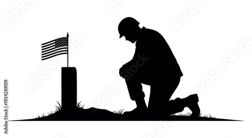 Soldier kneeling in respect beside American flag at memorial grave