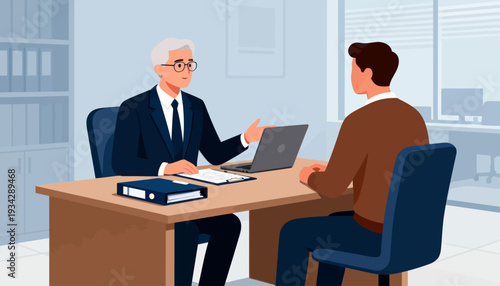 Businessman gestures during office meeting. Client listens attentively across desk. Laptop, files, and chair complete the setting. Professional atmosphere conveys trust and focus