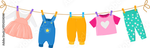 Hanging baby clothes and children's wear on a clothesline