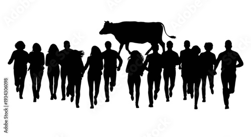 Group of people marching together carrying a large black silhouette of a cow