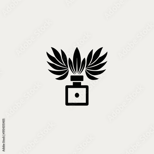 Black perfume bottle with floral design and wings illustration  