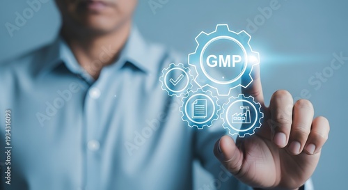 Man touching digital G M P with gears and checkmarks on screen