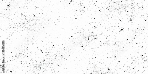 A macro pattern of liquid rain drops creates a wet texture on the dirty glass surface of an old window against a gray sky