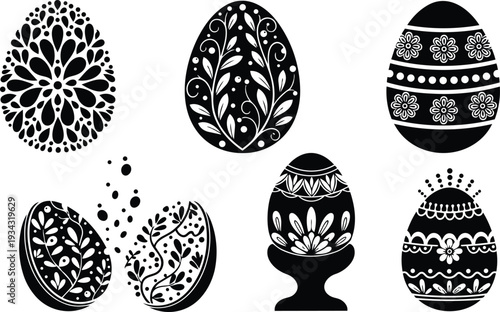 Decorative black silhouette easter eggs with floral patterns cracked egg in egg cup folk art hand painted designs isolated on white background festive studio backlit traditional