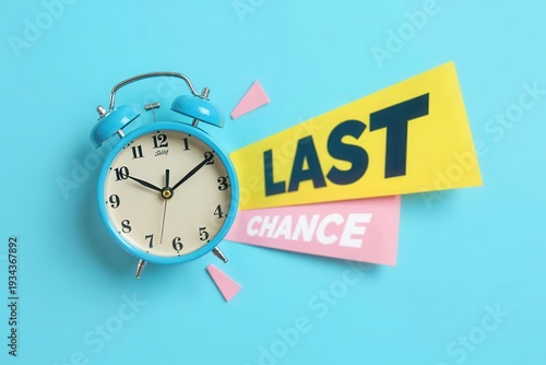 Blue alarm clock with yellow and pink last chance signs on a bright blue background, concept of time running out for a sale or offer