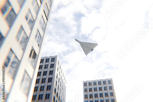 Tableau sur toile An Iranian military drone, the kamikaze shaheed, flies near modern high-rise buildings in the city