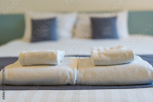 Wallpaper Mural A freshly made bed in a bright, airy room. A folded white towel Torontodigital.ca