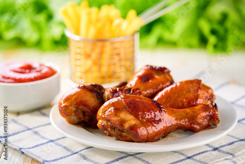 Wallpaper Mural Grilled chicken drumsticks with ketchup and french fry on a white wooden table. Torontodigital.ca