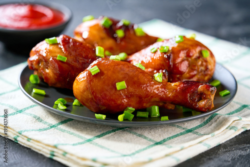 Wallpaper Mural Fried chicken legs with sauce on a black table, selective focus. Torontodigital.ca
