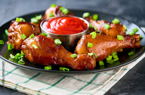 Wallpaper Mural Fried chicken legs with sauce on a black table, selective focus. Torontodigital.ca
