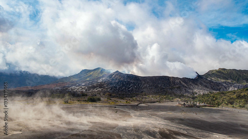 Fotografi Massive white plume rising from Mount Bromo crater, East Java, Indonesia