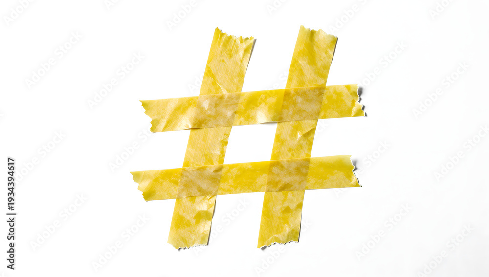 Obraz premium Hashtag Creation: A vibrant # symbol, crafted from tape, symbolizes connection and trends in a visually compelling presentation.