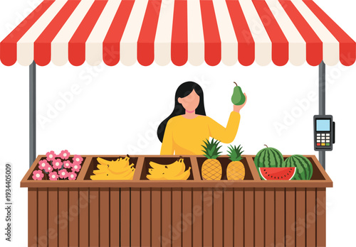 A female vendor selling fresh organic fruits including bananas pineapples and watermelons at a local market stall with striped awning and payment terminal