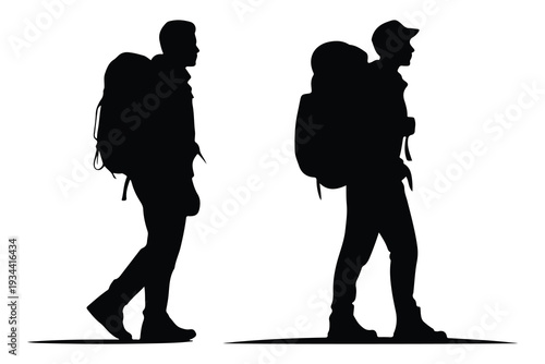 Silhouettes of two hikers with backpacks walking people