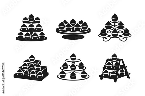 Collection of six black silhouette icons representing tiered cupcake stands with cupcakes