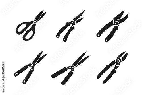 Collection of various black silhouette cutting tools on a white background
