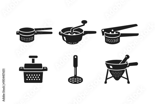 Collection of kitchen tools for preparing food, including presses and strainers