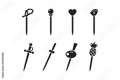 Collection of eight decorative cocktail picks with unique top designs on a white background