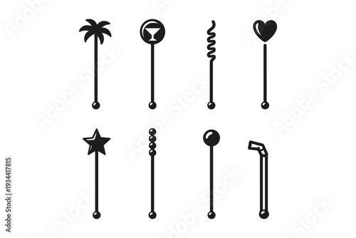 Collection of eight distinct cocktail stirrers with various decorative tops on white background