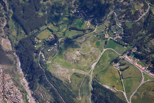 aerial perspective,captured moments before landing at Alejandro Velasco Astete International Airport, offers a first glimpse of the rugged beauty and agricultural heritage surrounding Cusco, Peru. 