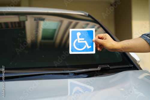 Wheelchair sticker sign on car for safety travel.
