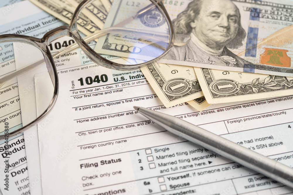 Obraz premium Tax form 1040 U.S. Individual Income Tax Return and bitcoin, business finance, Digital currency, Virtual cryptocurrency.