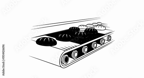 Loaves of bread moving along a conveyor belt in a bakery