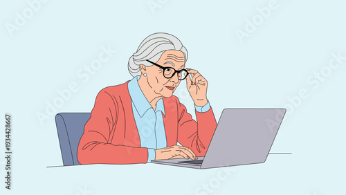 Elderly woman with grey hair and glasses working intently on her laptop computer while sitting at a desk in a clean home environment.