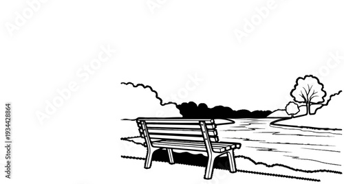 A park bench sits by a river with trees on the bank