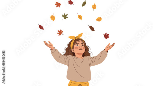 Happy young girl with curly hair looks up while throwing colorful autumn leaves into the air on a plain white background.