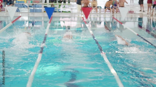Swimmers competing in a professional swimming race